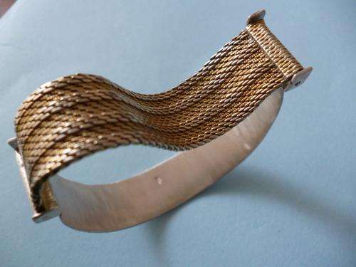 Solid Sterling Silver and Designer Rolled Gold Bangle. 33.6 grammes. Artisan made Fischer Glissando